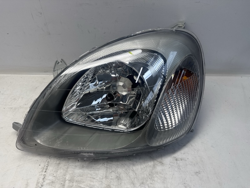 Фара Toyota YARIS NCP10 2002 левая