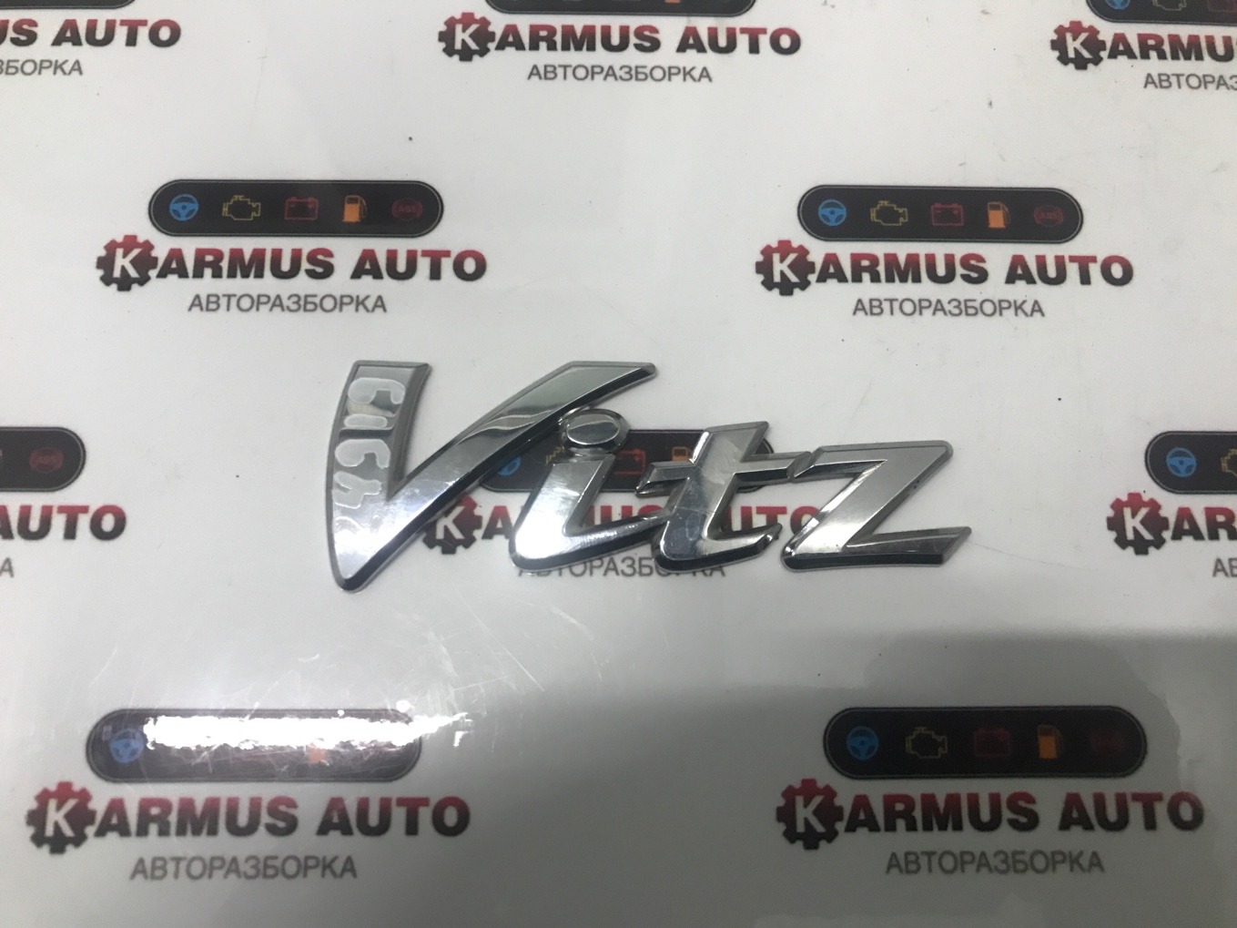 Эмблема Toyota Vitz KSP130 Эмблема Toyota Vitz KSP130