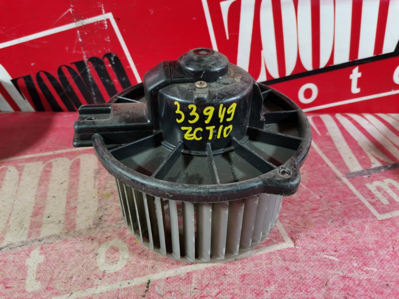 Вентилятор (мотор отопителя) Toyota Opa ZCT10 1ZZ-FE 2000 передний (б/у)