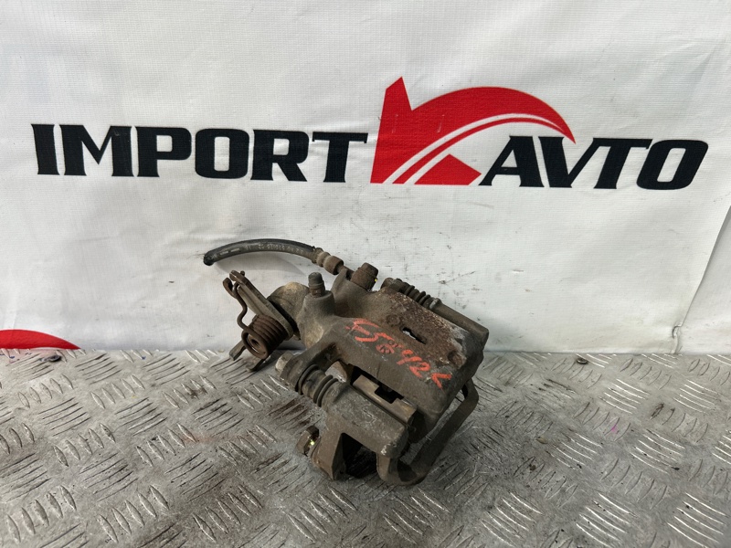 Суппорт тормозной NISSAN TINO V10 QG18DE 1998-2003 задний левый 520364