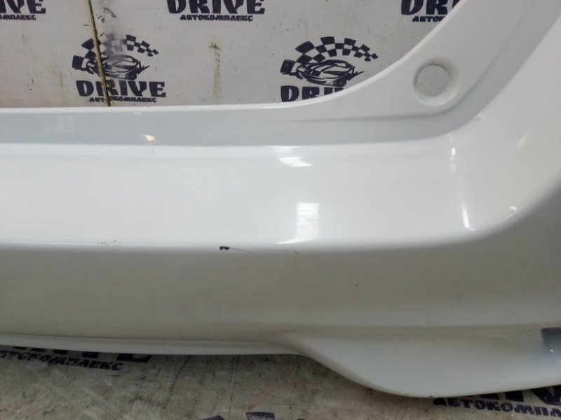 Бампер задний Corolla Fielder NZE161