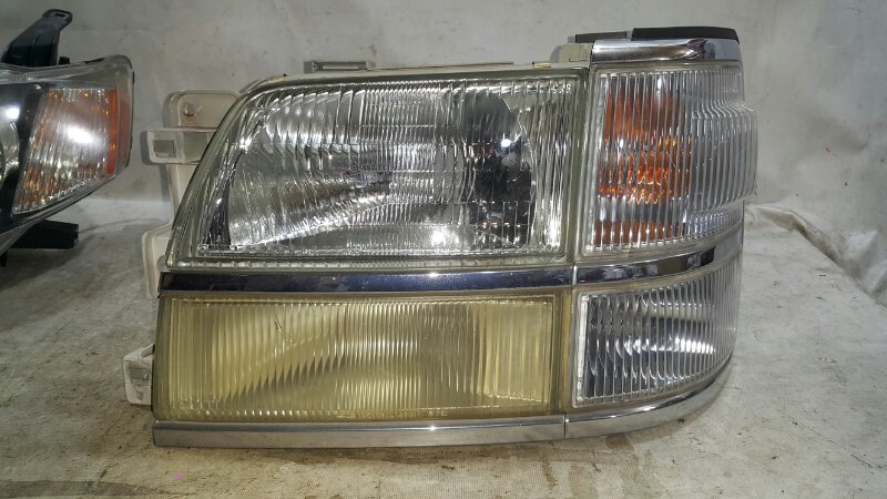 Фара NISSAN ELGRAND ALE50 левая (б/у)