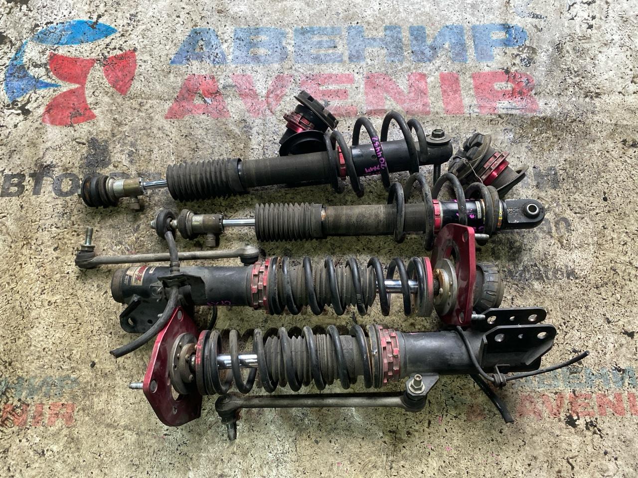 Стойка Nissan March AK12 CR12DE передняя