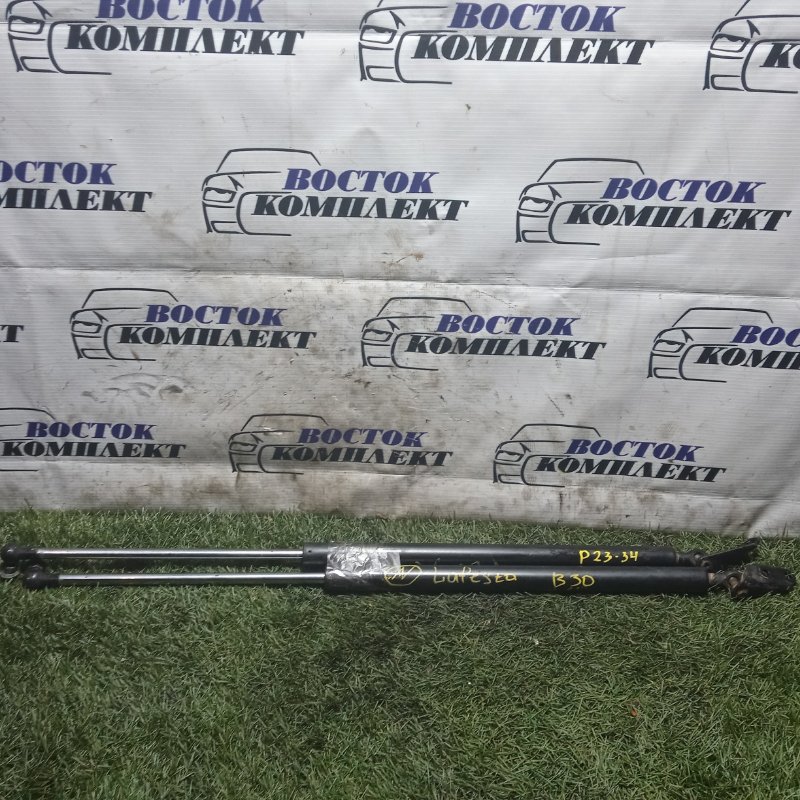 Амортизатор багажника Nissan Lafesta 2007 B30 MR20DE