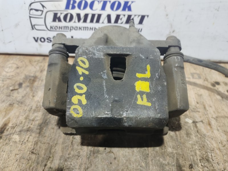 Суппорт Toyota Ractis NCP100 1NZ-FE перед лев