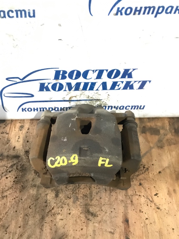 Суппорт Toyota Ractis 2009 SCP100 2SZ-FE перед лев