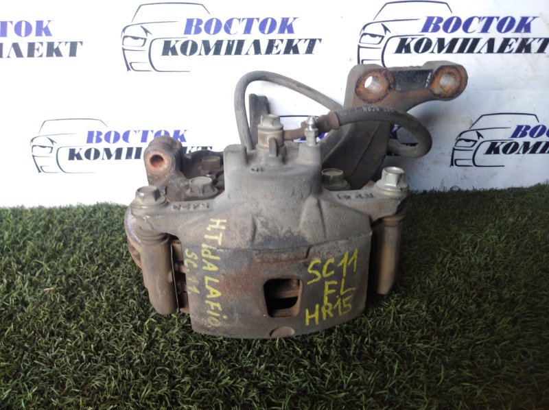 Суппорт Nissan Tiida Latio SC11 HR15DE перед лев