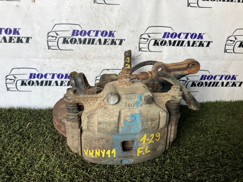 Суппорт Mazda Familia BVHNY11 QG18DE перед лев