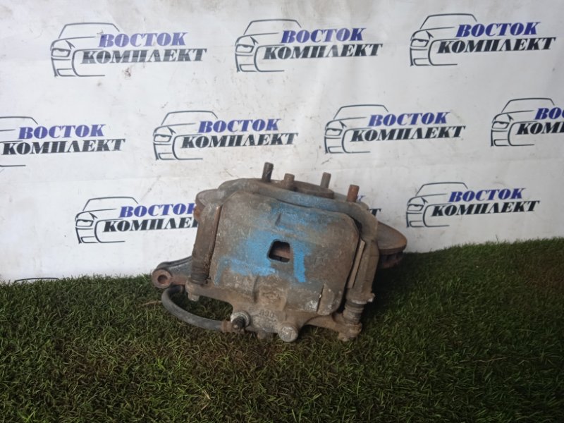 Суппорт Mazda Familia BVHNY11 QG18DE перед лев