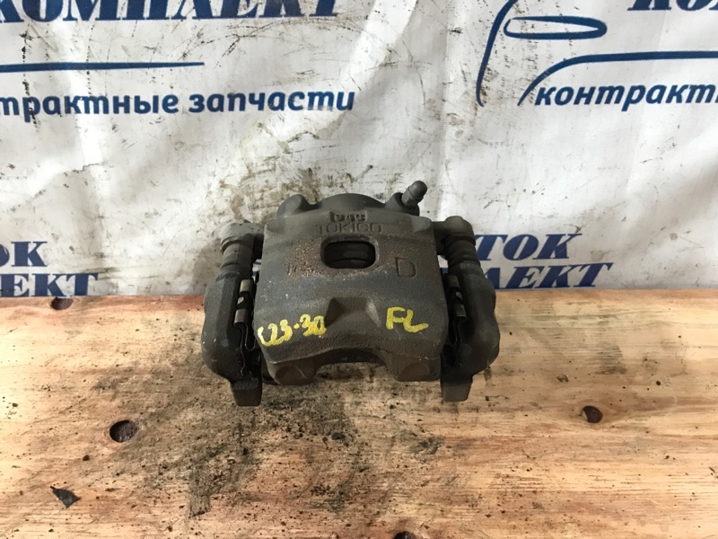 Суппорт Toyota Passo 2009 KGC10 1KR-FE перед лев