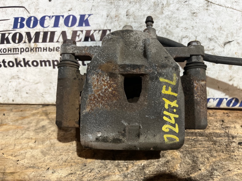 Суппорт Toyota Ractis 2006 NCP105 1NZ-FE перед лев