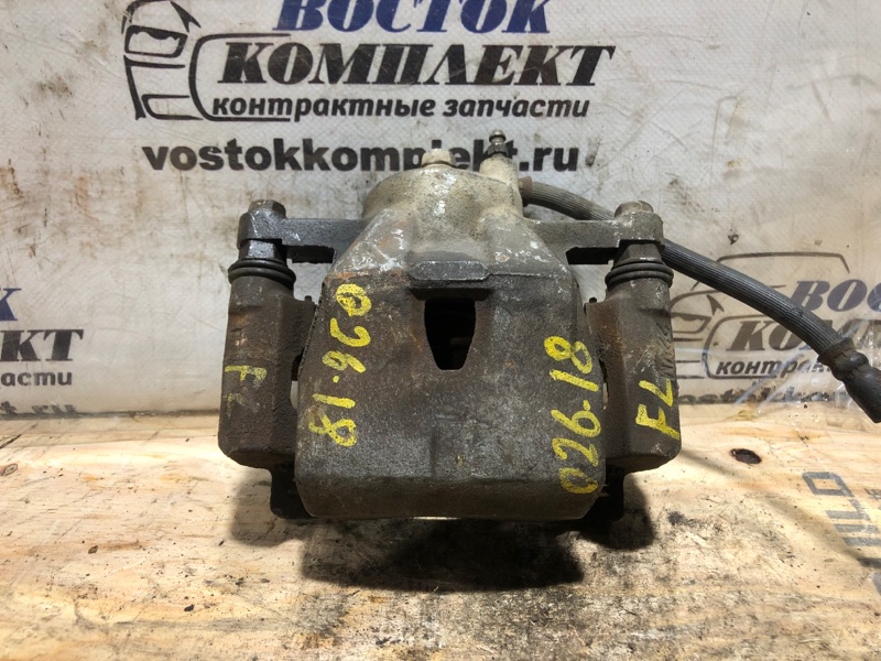 Суппорт Toyota Vitz 2007 SCP90 2SZ-FE перед лев