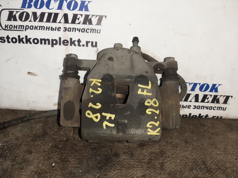 Суппорт Toyota Ractis NCP100 1NZ-FE перед лев