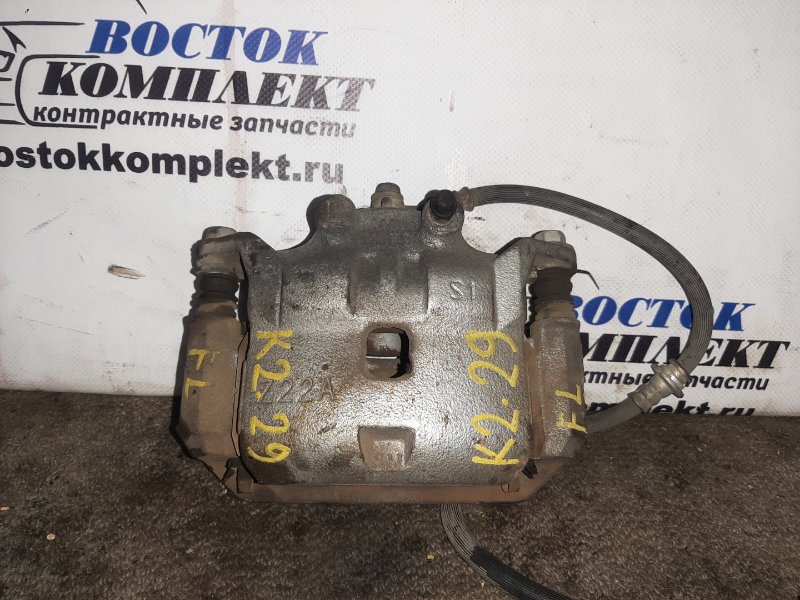 Суппорт Nissan Note E12 HR12DE перед лев