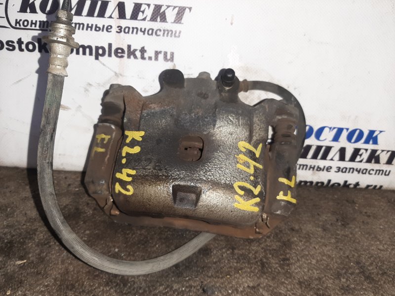 Суппорт Nissan Note E12 HR12DE перед лев