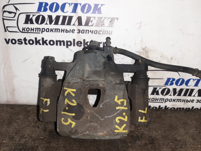 Суппорт Toyota Vitz 2005 SCP90 2SZ-FE перед лев