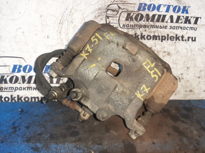 Суппорт Nissan Note E12 HR12DE перед лев