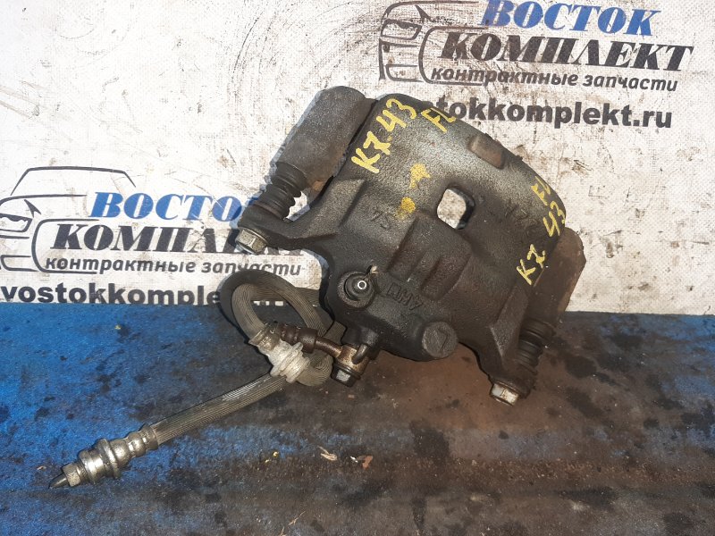 Суппорт Nissan Note E12 HR12DE перед лев