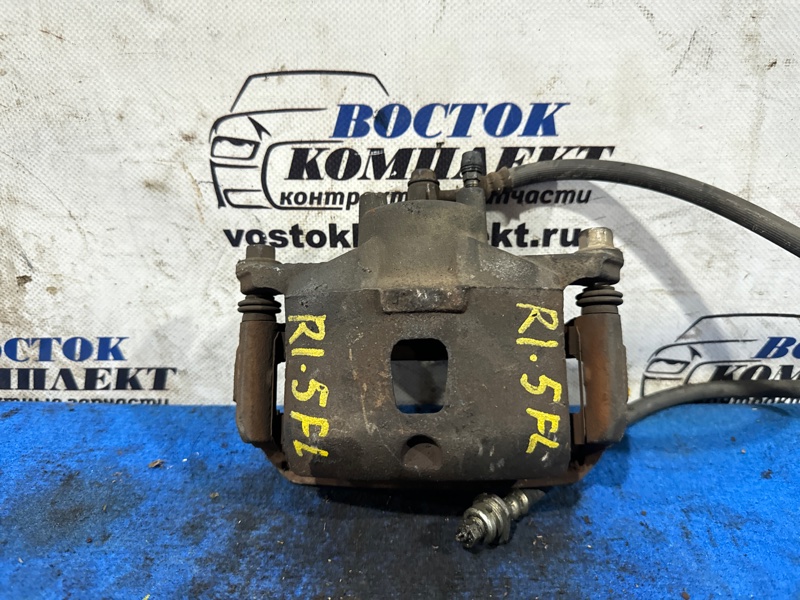 Суппорт Nissan March AK12 CR12DE перед лев