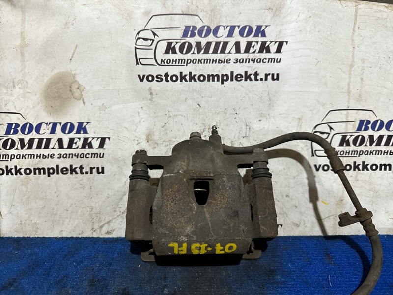 Суппорт Toyota Vitz NCP91 1NZ-FE перед лев