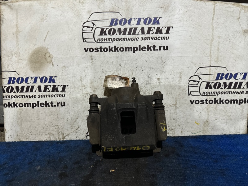 Суппорт Toyota Porte 2004 NNP11 1NZ-FE перед лев