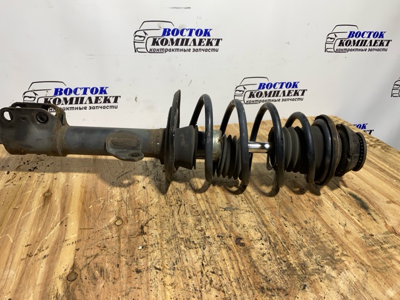 Стойка подвески Toyota Ractis 2008 NCP105 1NZ-FE перед лев