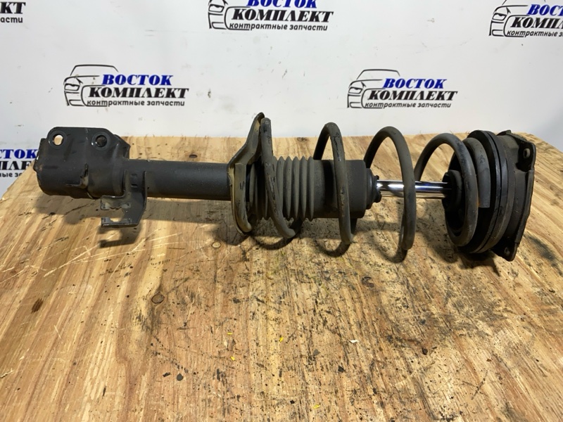 Стойка подвески Nissan March AK12 CR12DE перед лев