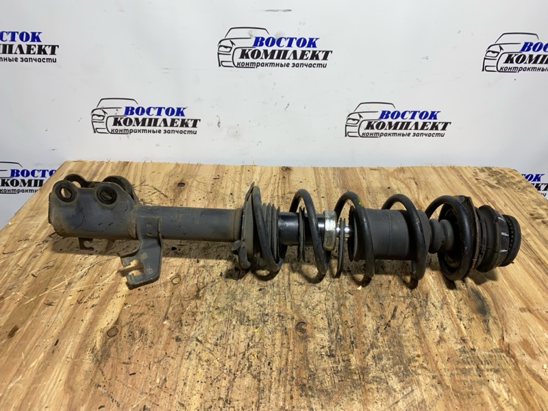 Стойка подвески Nissan March K13 HR12DE перед лев