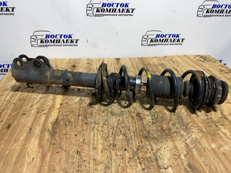 Стойка подвески Nissan March K13 HR12DE перед лев