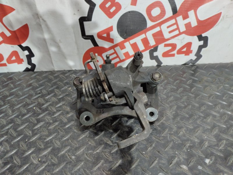 Суппорт тормозной задний правый Nissan CEFIRO A32 VQ20DE