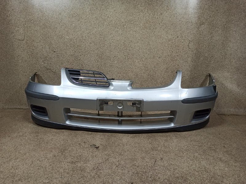 Бампер Nissan Tino V10 передний Бампер Nissan Tino V10 передний