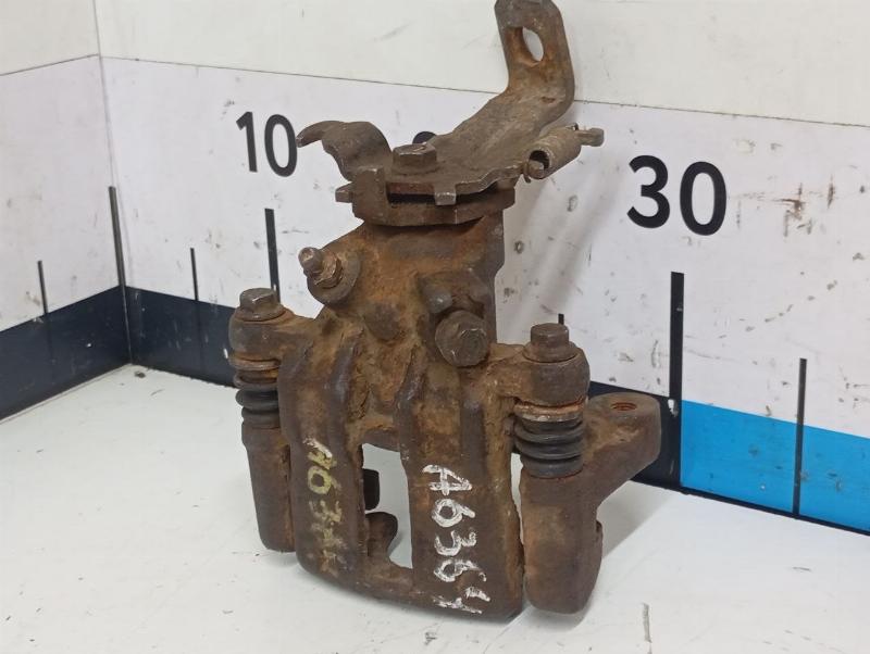 Суппорт тормозной задний левый Nissan Almera N16