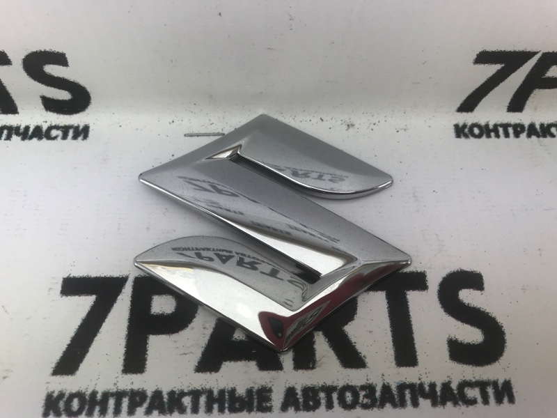 Эмблема Suzuki Эмблема Suzuki