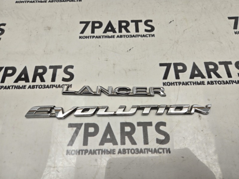 Эмблема MITSUBISHI LANCER EVOLUTION CZ4A (б/у) Эмблема MITSUBISHI LANCER EVOLUTION CZ4A (б/у)