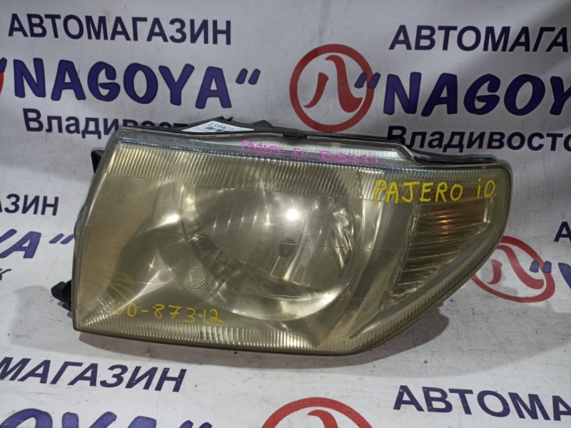 Фара MITSUBISHI PAJERO IO H77W 4G94 передняя левая 100-87312 (б/у)