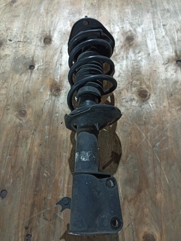 Стойка TOYOTA CAMI J122E K3-VE передняя левая (б/у)