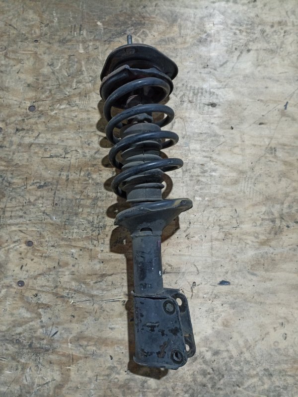 Стойка TOYOTA CAMI J102E K3-VE передняя левая (б/у)