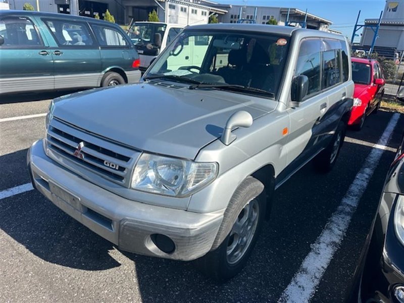 Планка под фары MITSUBISHI PAJERO IO H76W 4G93 передняя COLOR A71 (б/у)