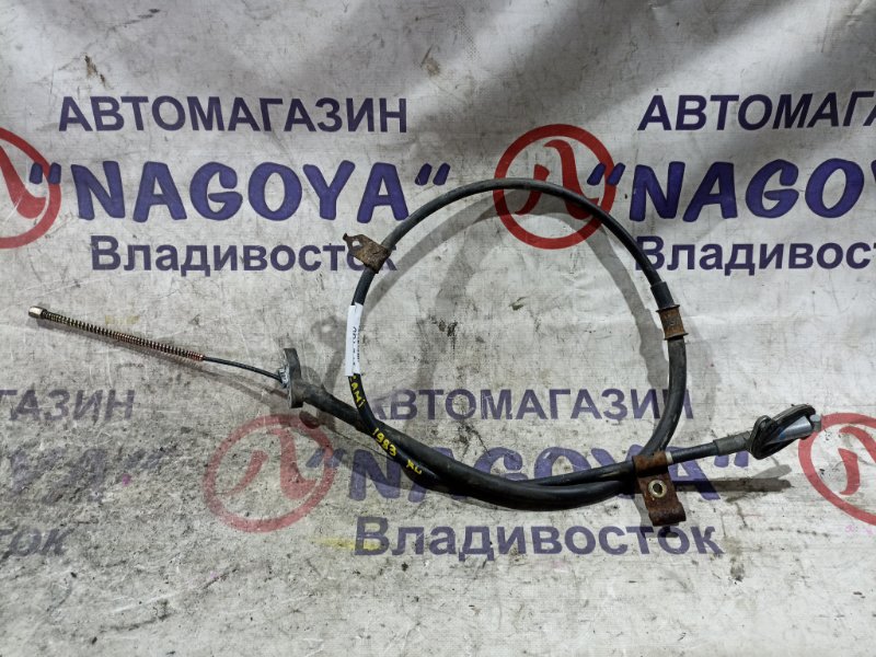 Тросик ручного тормоза TOYOTA CAMI J102E K3-VE задний левый (б/у)