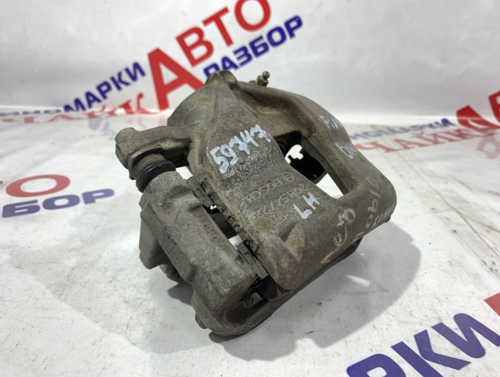 Суппорт тормозной передний левый Doblo