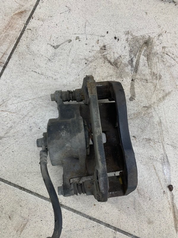 Суппорт тормозной передний левый Honda Accord CL7