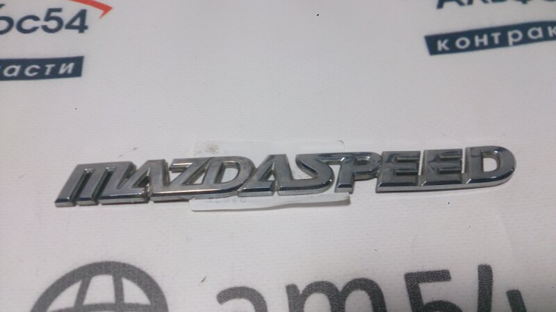Эмблема Mazda Axela BK5P