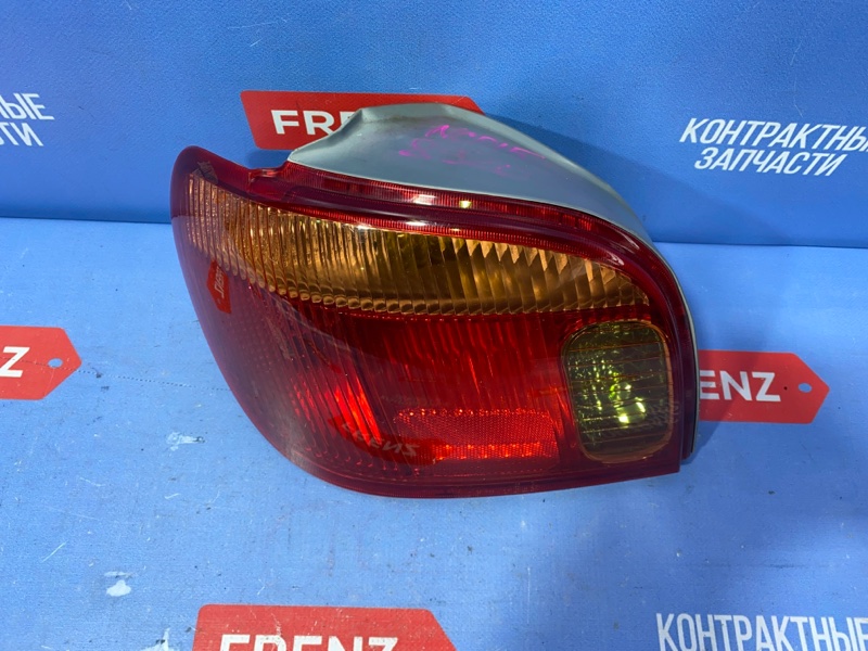 Фонарь левый Toyota Yaris NCP10