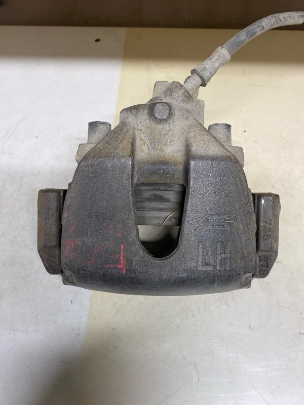 Суппорт тормозной передний левый Ford Focus 2 1682876 Б/У
