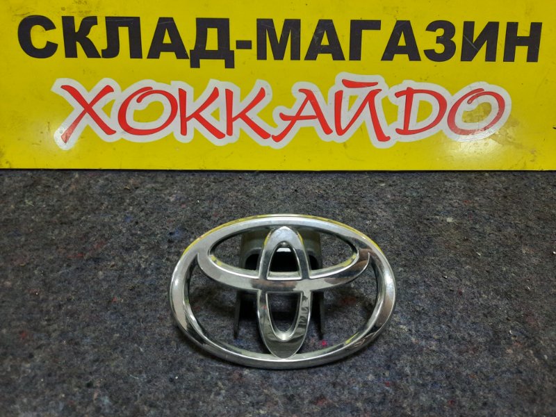 Эмблема Toyota Corolla NZE121 1NZ-FE 05.2001 задняя
