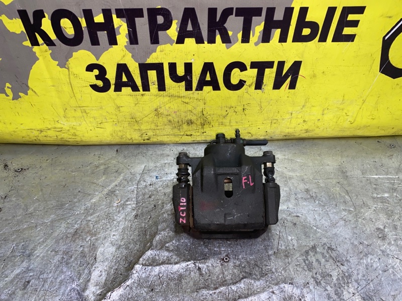 Суппорт Toyota Opa ZCT10 1ZZ-FE 06.2002 передний левый