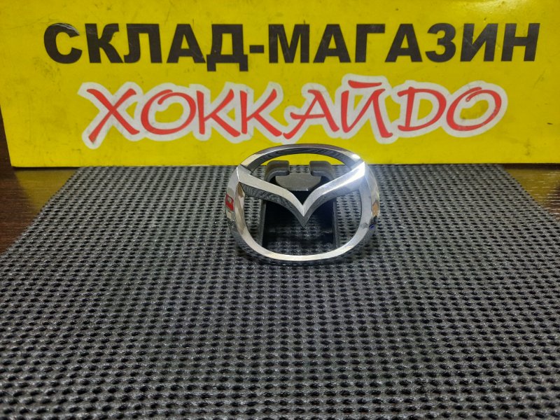 Эмблема Mazda Familia BVY11 QG15DE 06.1999 задняя