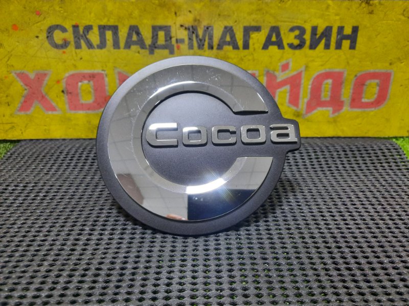 Эмблема Daihatsu Mira Cocoa L675S KF 04.2012 передняя