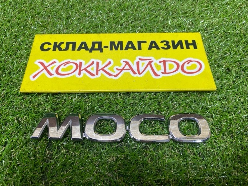 Эмблема Nissan Moco MG22S K6A 2010 задняя