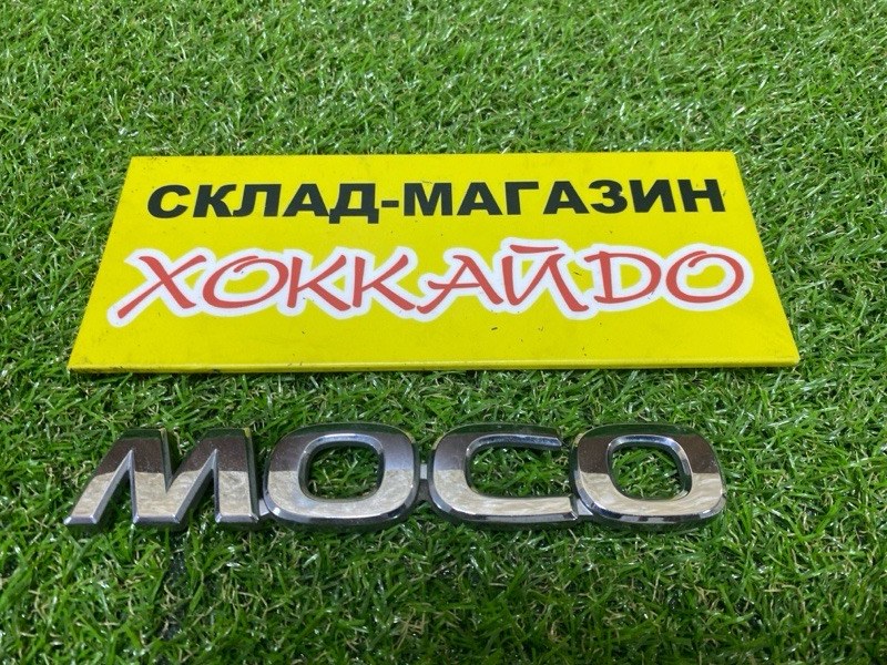 Эмблема Nissan Moco MG22S K6A 2010 задняя